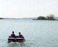 Kids boating on Lake Peten Itza Guatemala