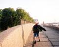 Child walking along the Neva River, St. Petersburg, Russia